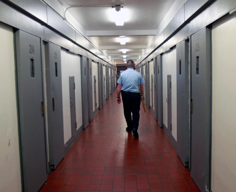 In this Feb. 1, 2012 file photo, a corrections officer walks in a cell block at Coxsackie Correctional Facility in Coxsackie, N.Y.