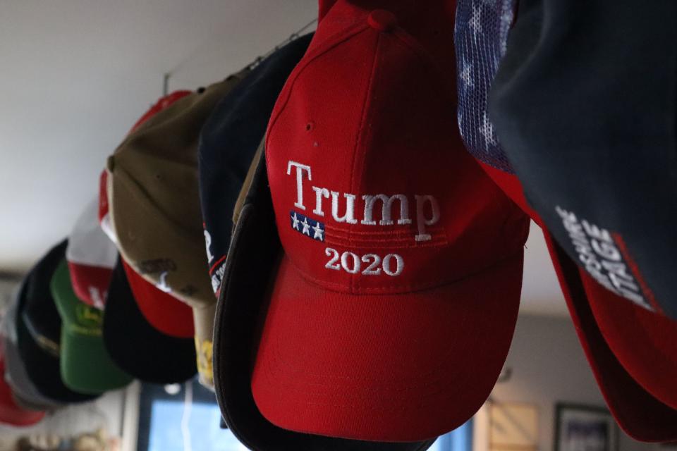 Trump hats hang from the ceiling at Gary’s Barber Shop in Wolfeboro, N.H, on Saturday, Jan. 20, 2024. | Samuel Benson, Deseret News