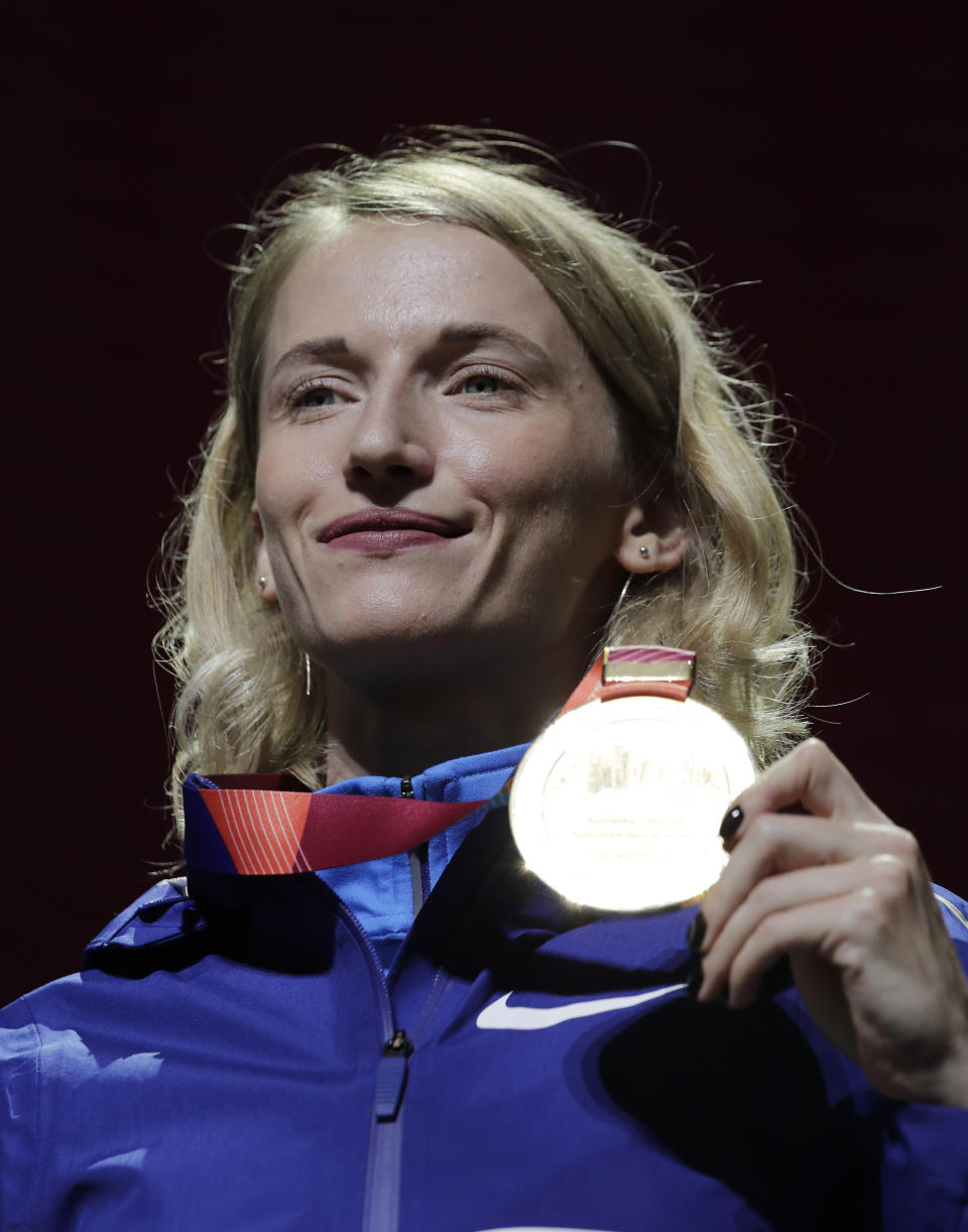 Gold medalist in the women's pole vault Anzhelika Sidorova, who participates as a neutral athlete, poses during the medal ceremony at the World Athletics Championships in Doha, Qatar, Monday, Sept. 30, 2019. (AP Photo/Nariman El-Mofty)