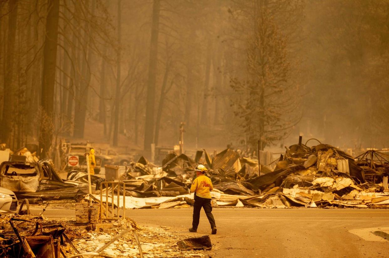 <span class="caption">The Dixie Fire devastated rural Greenville, California, a town of 800 residents, on Aug. 4, 2021.</span> <span class="attribution"><a class="link " href="https://www.gettyimages.com/detail/news-photo/firefighter-surveys-a-destroyed-downtown-during-the-dixie-news-photo/1234491141?adppopup=true" rel="nofollow noopener" target="_blank" data-ylk="slk:Josh Edelson/AFP via Getty Images;elm:context_link;itc:0;sec:content-canvas">Josh Edelson/AFP via Getty Images</a></span>