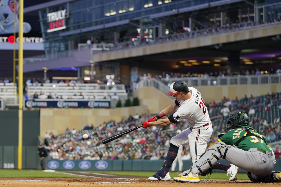 Minnesota Twins' Max Kepler hits a single against the Oakland Athletics during the first inning of a baseball game Wednesday, Sept. 27, 2023, in Minneapolis. (AP Photo/Abbie Parr)