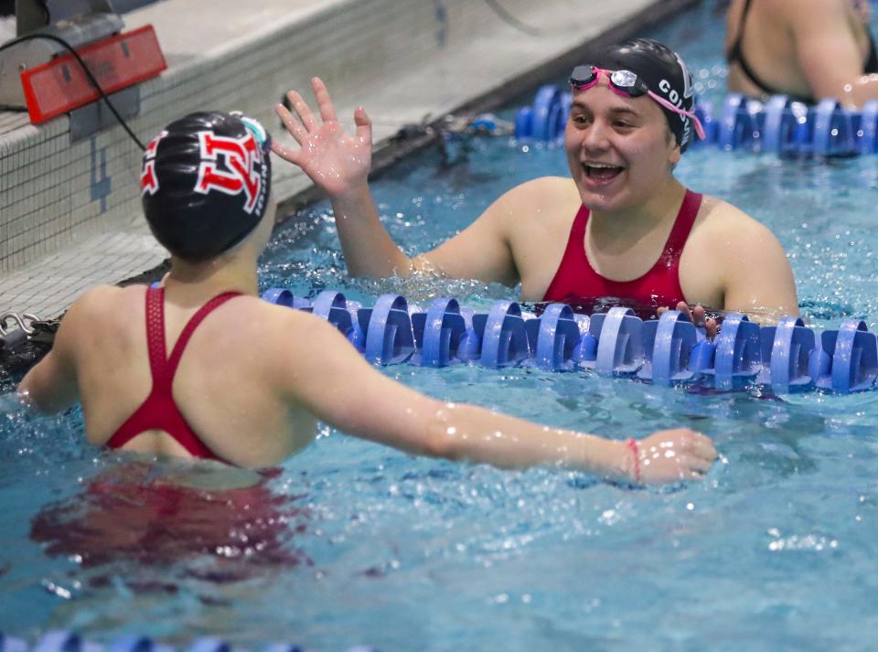 100-yard backstroke winner Georgia Colborn of Charter School of Wilmington (right) shares congratulations with second place finisher Eliza Johnson of Ursuline during the DIAA girls swimming state championships at Rawstrom Natatorium at the University of Delaware, Saturday, Feb. 25, 2023.