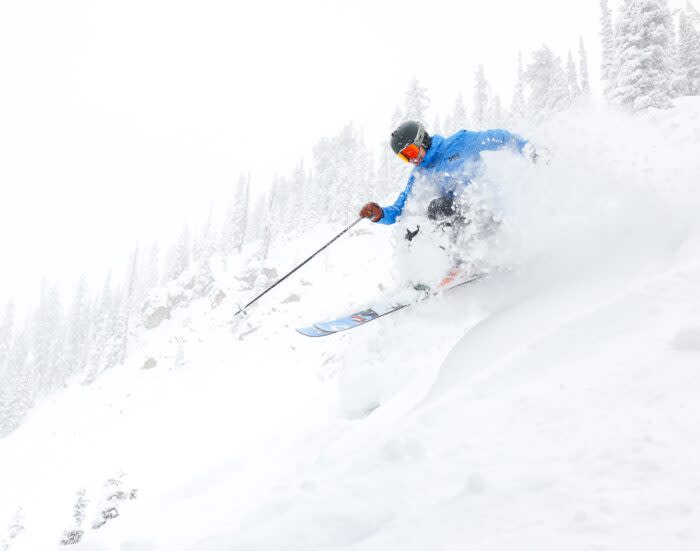 A skier rides through powder at The Extremes in Crested Butte