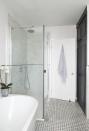 <p>With a soft monochrome colour scheme and modern tiling behind the shower, this family bathroom is the perfect way to create a bright space. </p><p><a class="link " href="https://www.housebeautiful.com/uk/renovate/news/a623/makeover-dated-bathroom-given-stylish-contemporary-transformation/" rel="nofollow noopener" target="_blank" data-ylk="slk:TAKE A TOUR;elm:context_link;itc:0;sec:content-canvas">TAKE A TOUR</a></p>