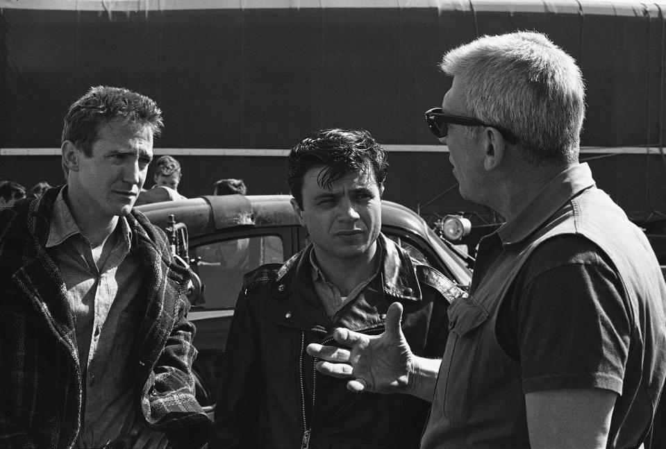 Director Richard Brooks, right, talks to actors Scott Wilson, left, and Robert Blake during filming of “In Cold Blood” on March 10, 1967, in Kansas City, Kansas. (AP Photo/William P. Straeter)