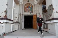 Believers attend the Orthodox Easter service at a church in Mariupol