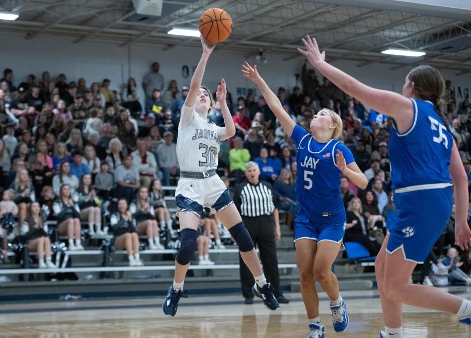 Autumn Boutwell (30) shoots in front of a large crowd during the Jay vs Central girls basketball game at Central High School in Milton on Friday, Jan. 13, 2023.