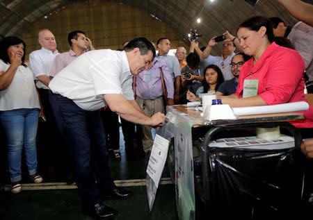 Paraguayan President Horacio Cartes casts his vote in a polling station during elections in Asuncion, Paraguay, April 22, 2018. REUTERS/Mario Valdez
