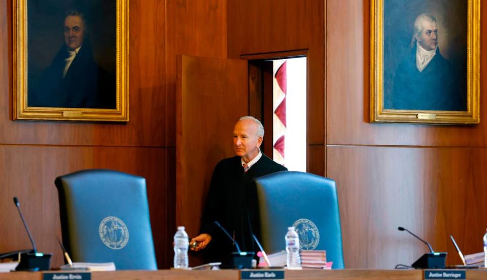 Chief Justice Paul Newby enters the courtroom before oral arguments at the North Carolina Supreme Court in Raleigh on May 9, 2022.