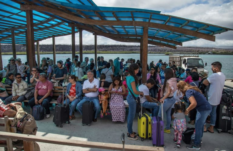 A group of tourists arrive on Santa Cruz Island after crossing the Itabaca channel in the Galapagos -- by law, even Ecuadorans from the mainland are treated as foreigners on the islands