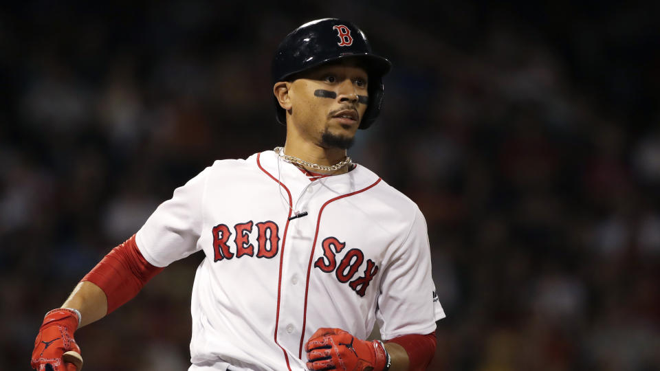 Boston Red Sox's Mookie Betts runs to first base during a baseball game against the Tampa Bay Rays at Fenway Park, Thursday, Aug. 1, 2019, in Boston. (AP Photo/Elise Amendola)