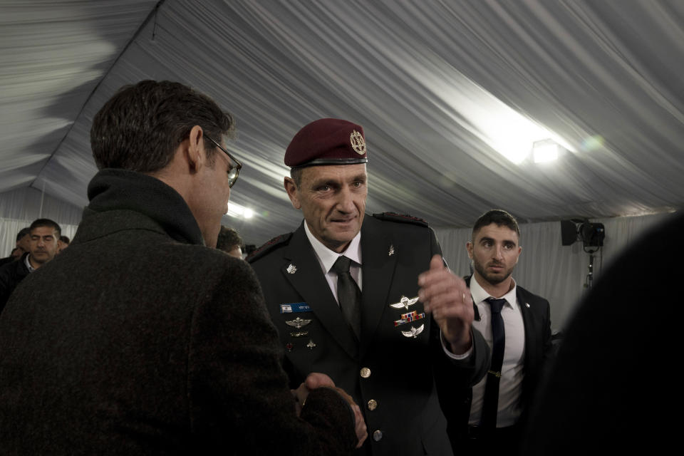 A well-wisher speaks to Israel Defense Forces Chief of Staff Herzi Halevi after his transition ceremony with the Prime Minister, Defense Minister, and the outgoing chief, in Jerusalem, Monday, Jan. 16, 2023. (AP Photo/ Maya Alleruzzo, Pool)