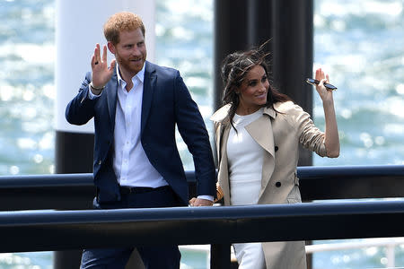 Britain's Prince Harry, the Duke of Sussex and his wife Meghan, the Duchess of Sussex are seen arriving at the Sydney Opera House in Sydney, Australia, October 16, 2018. AAP/Dan Himbrechts/via REUTERS