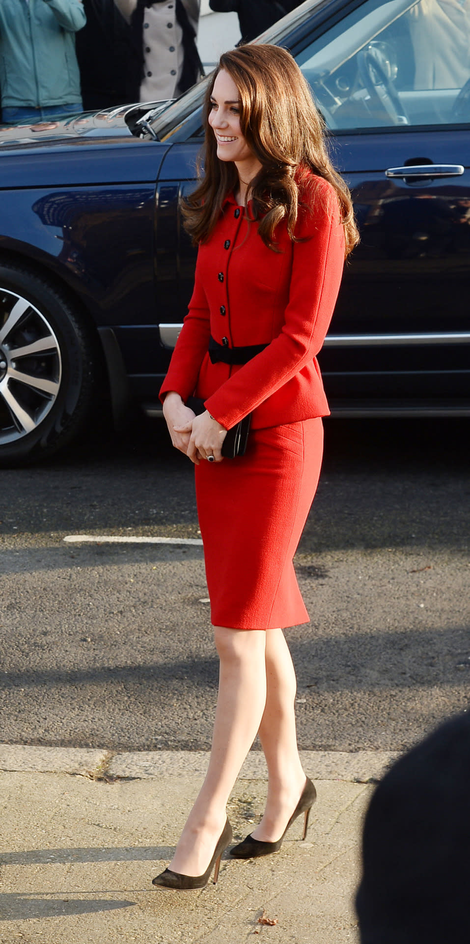 <p>Kate chose one of her favourite suits for a London school visit. Donning a bold red skirt suit by Italian designer Luisa Spagnoli, the Duchess attended a school assembly as part of her mental health initiative. Black suede pumps and a matching clutch proved to be ther perfect simple accessories.</p><p><i>[Photo: PA]</i></p>