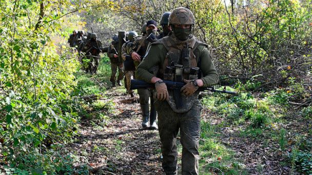 PHOTO: In this Oct. 13, 2022, file photo, service members of Russian private military company Wagner Group bring combat groups to their positions, as Russia's military operation in Ukraine continues, in Luhansk. (Viktor Antonyuk/Sputnik via AP, FILE)