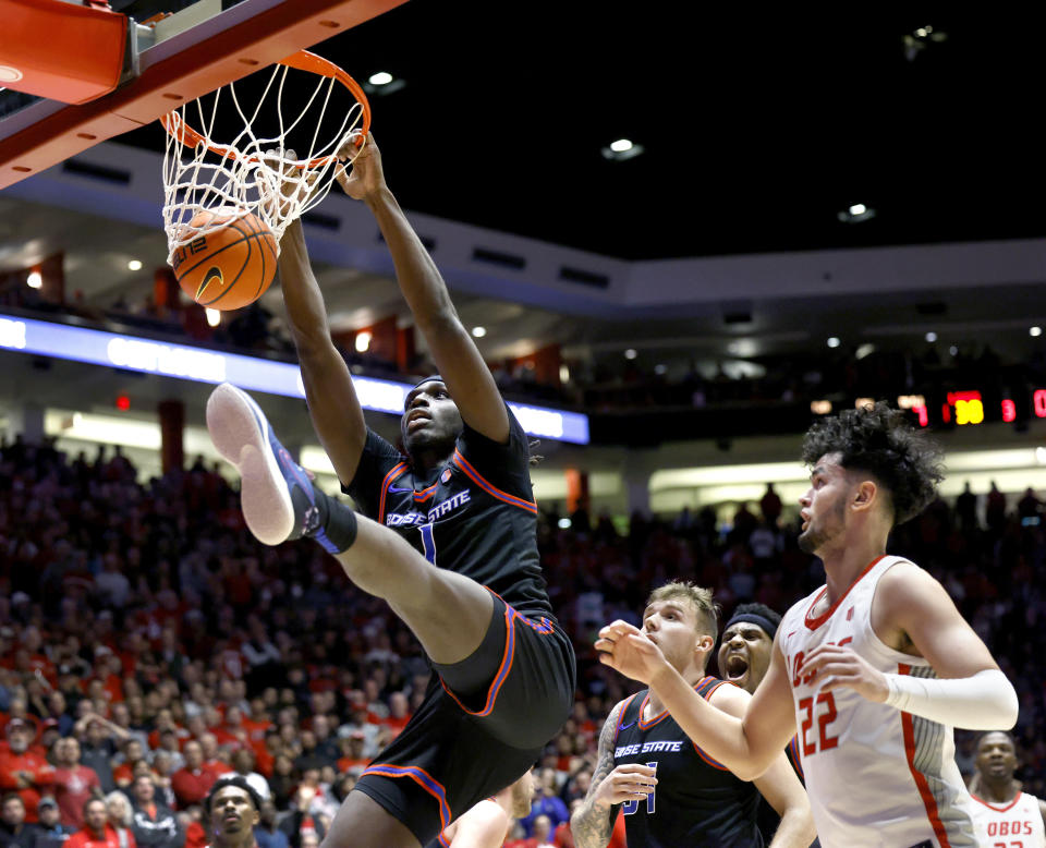 Boise State forward O'Mar Stanley scores on a dunk as New Mexico forward Mustapha Amzil, right, defends during the first half of an NCAA college basketball game, Wednesday, Jan. 31, 2024, in Albuquerque, N.M. (AP Photo/Eric Draper)