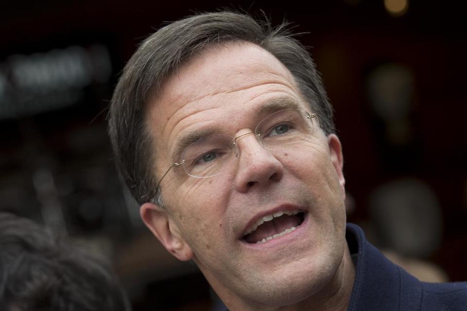 Dutch Prime Minister Mark Rutte talks to the media during a campaign stop in Breda, Netherlands, Saturday, March 11, 2017. (AP Photo/Peter Dejong)