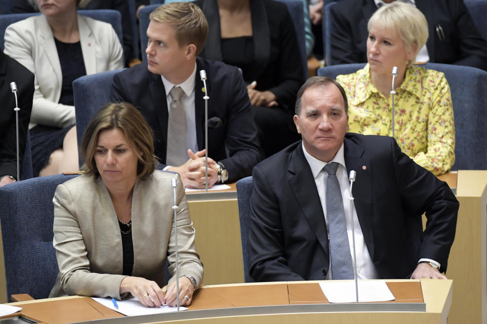 Swedish Prime Minister Stefan Lofven, right, attends parliament during a vote of confidence in the Swedish Parliament Riksdagen, Tuesday Sept. 25, 2018. The prime minister lost a vote of confidence in parliament, meaning he will have to step down. He will continue as caretaker prime minister until a new government can be formed. (Anders Wiklund/TT via AP)