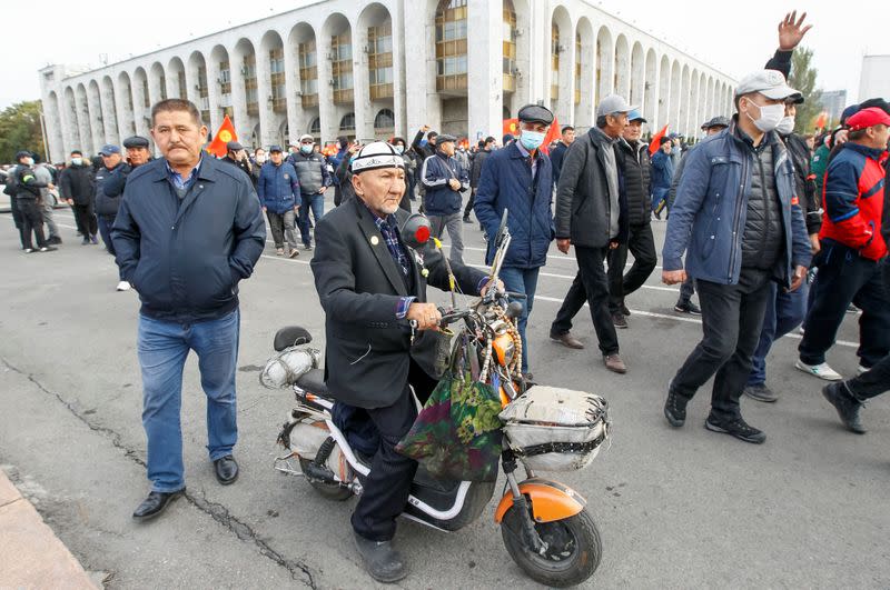 Demonstrators from rival political groups attend a rally in Bishkek