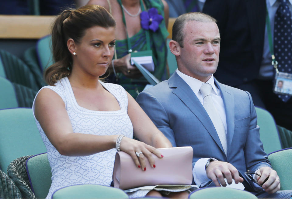 Tennis - Wimbledon - All England Lawn Tennis & Croquet Club, Wimbledon, England - 7/7/13 
Men's Singles - Manchester United's Wayne Rooney and wife Coleen in the stands before the start of the final 
Mandatory Credit: Action Images / Andrew Couldridge 
Livepic