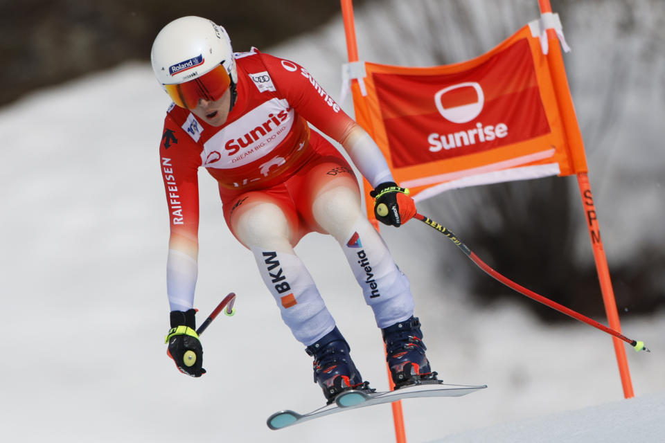Switzerland's Jasmine Flury speeds down the course during an alpine ski, women's World Cup downhill race, in Crans Montana, Switzerland, Friday, Feb. 16, 2024. (AP Photo/Giovanni Pizzato)