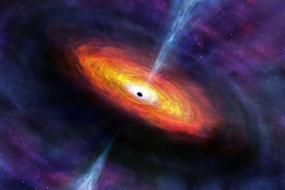 An artist’s illustration of an accreting supermassive black hole. The central black hole is black, while its surrounding gas heats up and shines to produce light. Nahks Tr'Ehnl (Penn State)