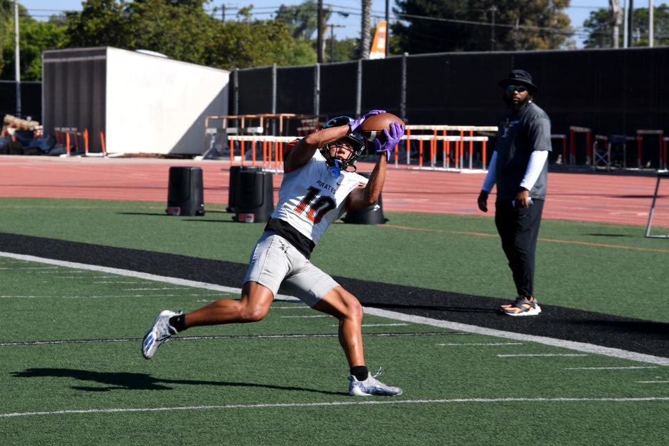 Eli Aragon stretches to make a catch during a Ventura College football practice on Tuesday, Aug. 30, 2023. The Pirates open their season Saturday at Saddleback.