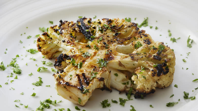 Grilled cauliflower steak on plate