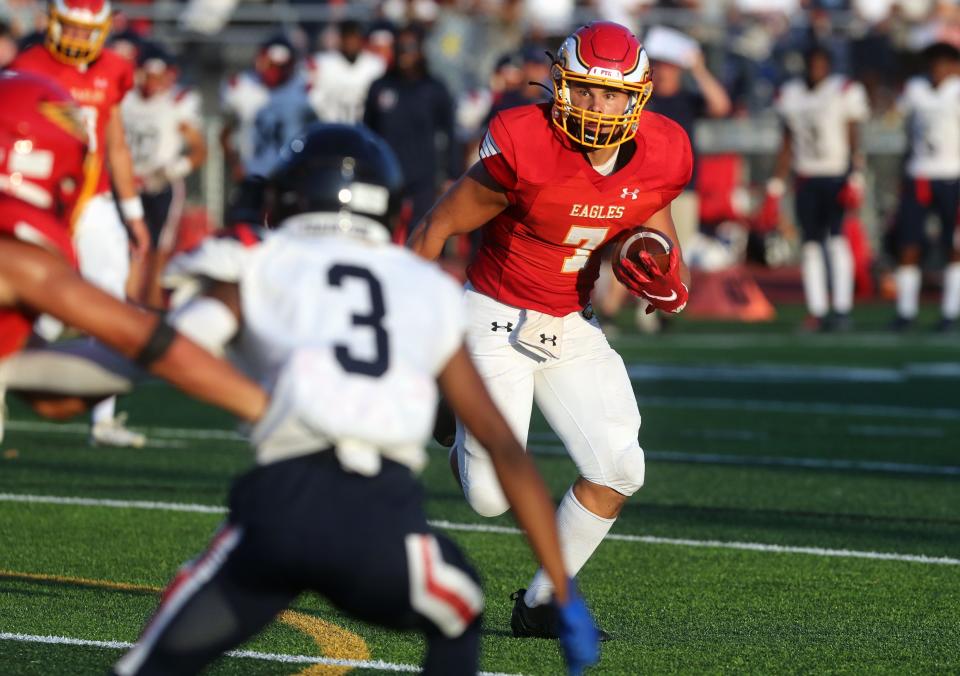 Big Walnut's Nate Severs looks for running room during a game against Hartley on Aug. 19 at Big Walnut High School in Sunbury.