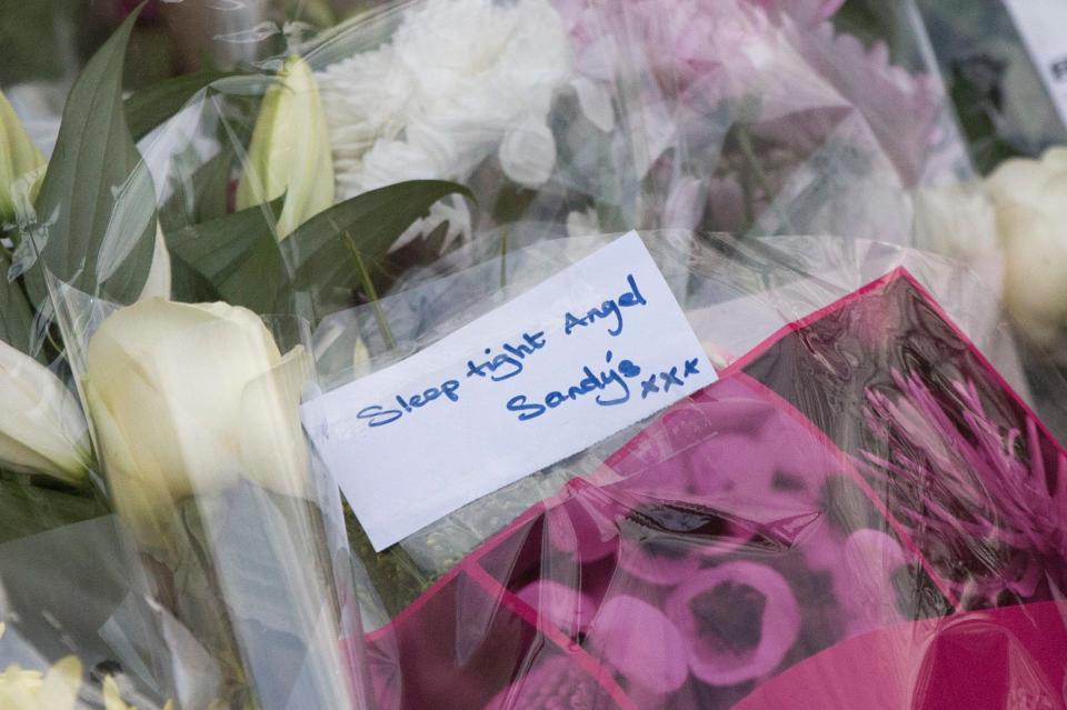 Tributes were left outside the school(PA)