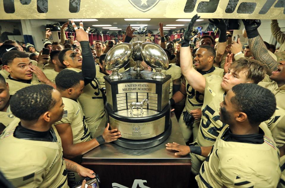 Army celebrates with the Commander-in-Chief Trophy after a 17-11 win against Navy at the Army-Navy Game at Gillette Stadium. Danny Wild-USA TODAY Sports