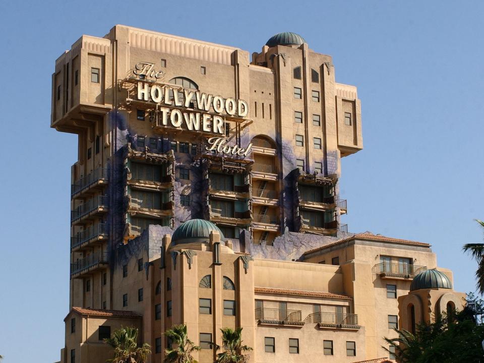 A decaying and dirty designed building with the sign "The Hollywood Tower of Terror."