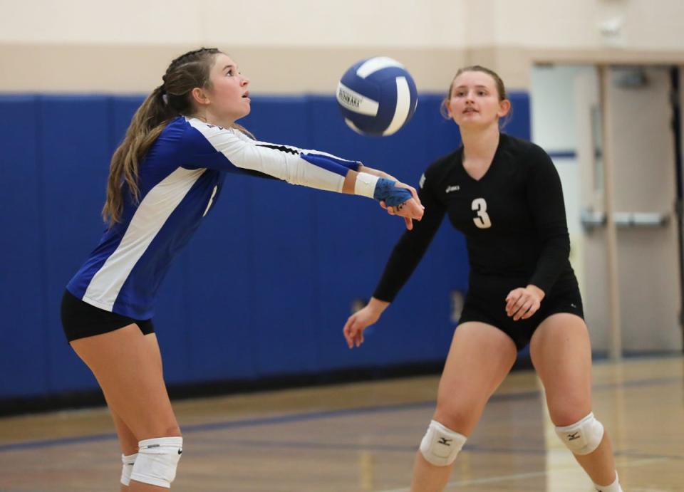 Danville’s Jaeda Molle bumps the ball in their in over Lone Tree. Molle was recognized for getting her 500th dig.