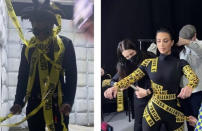 Kim partners with Balenciaga regularly to create fashion moments that will never be forgotten, and their collab at Paris Fashion Week in 2022 was no exception. Kim turned up to the event in a catsuit made from Balenciaga emblazoned caution tape, and even carried Balenciaga's signature Hourglass Bag, also covered in the tape, to match.