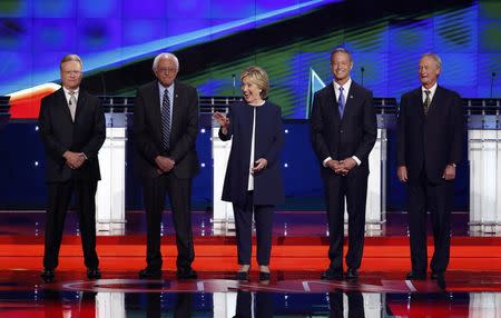 Democratic U.S. presidential candidates (L-R) former U.S. Senator Jim Webb, U.S. Senator Bernie Sanders, former Secretary of State Hillary Clinton, former Maryland Governor Martin O'Malley and former Governor of Rhode Island Lincoln Chafee pose before the start of the first official Democratic candidates debate of the 2016 presidential campaign in Las Vegas, Nevada October 13, 2015. REUTERS/Lucy Nicholson