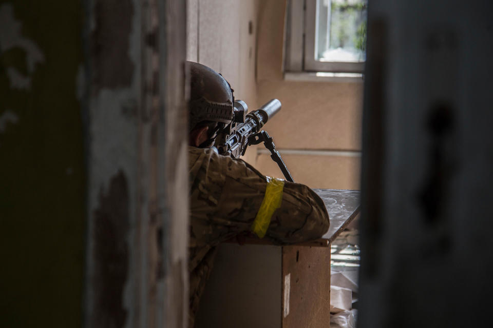 A Ukrainian soldier is in position during heavy fighting on the front line in Severodonetsk, in the Luhansk region, on June 8, 2022. - Credit: Oleksandr Ratushniak/AP