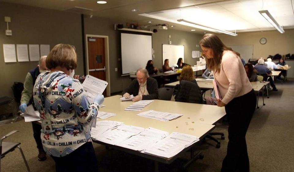 Darcia Stebbens of San Miguel, who requested the recount in the District 2 supervisor race, looks over ballots being sorted in an auxiliary room at the Katcho Achadjian Government Center on Tuesday, Dec. 20, 2022. Laura Dickinson/ldickinson@thetribunenews.com