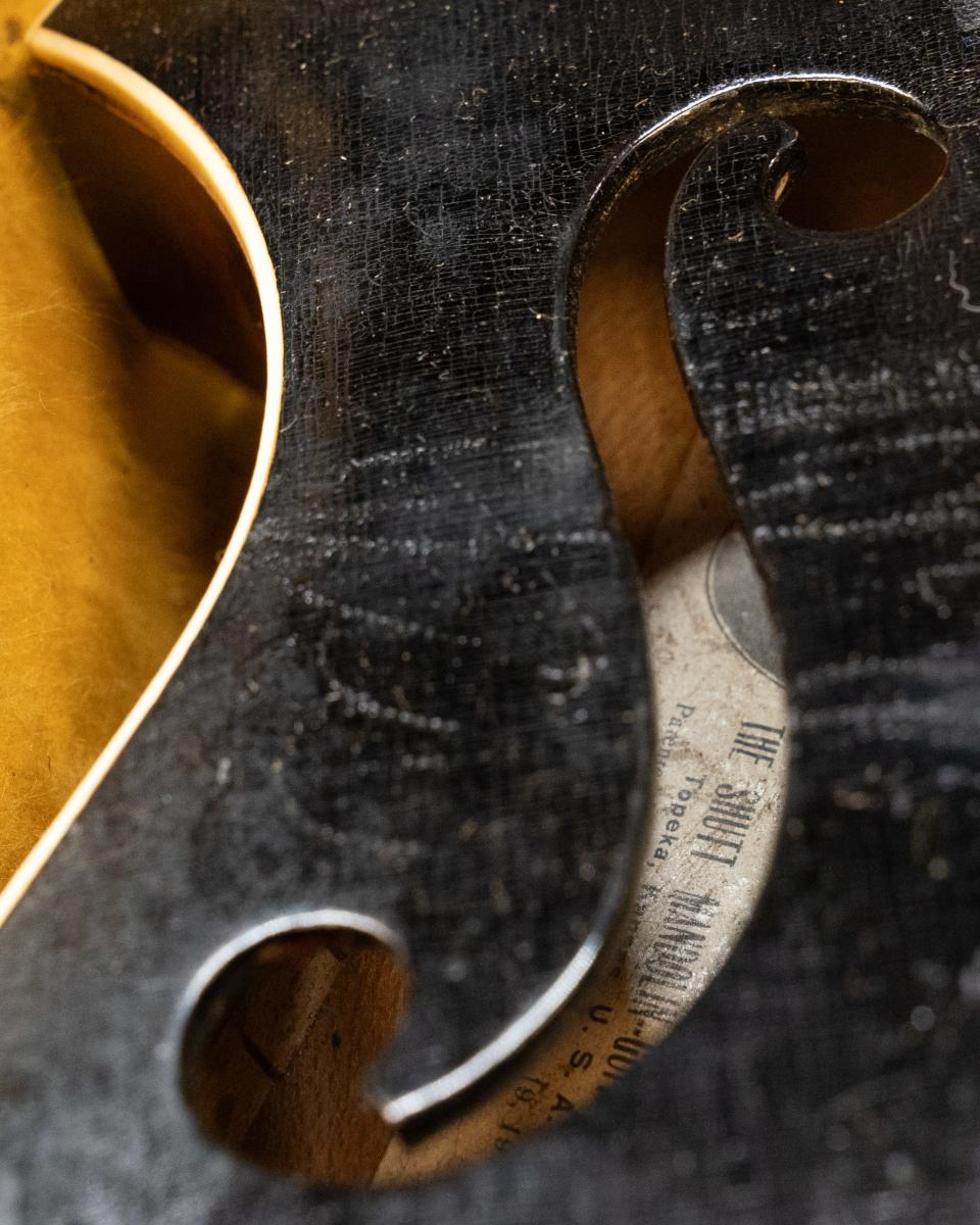 The original label of a Shutt mandolin shows it was manufactured in Topeka and patented.