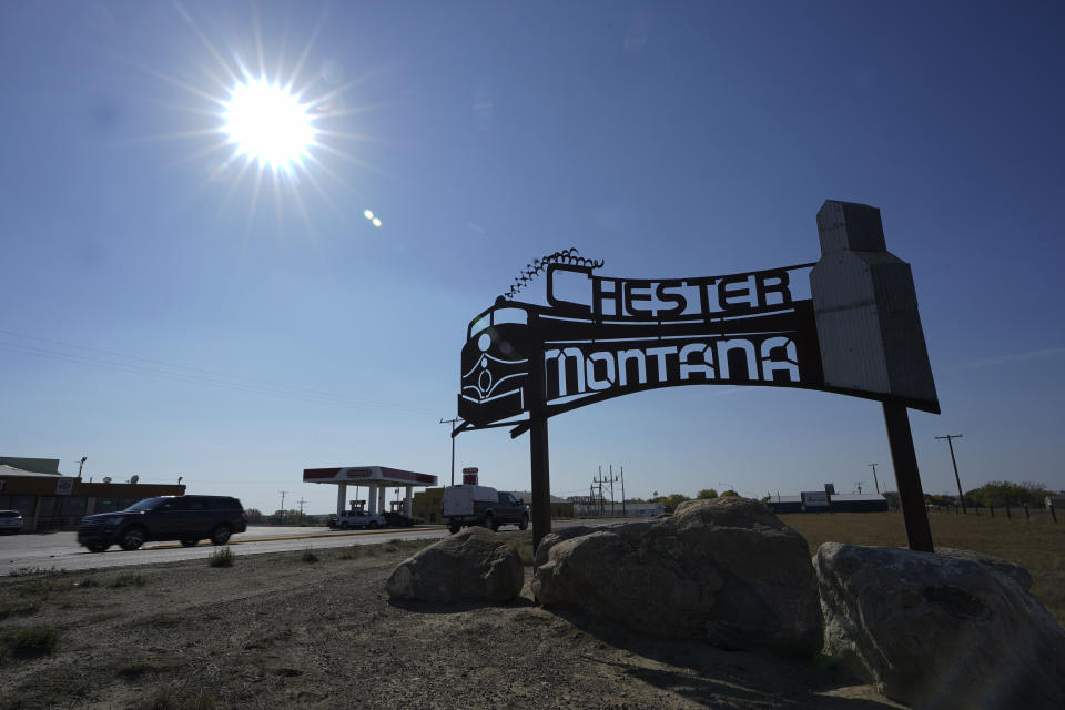 An image of a train is featured on a sign for the town of Chester, Mont., Monday, Sept. 27, 2021, near the scene where an Amtrak train derailed Saturday, killing three people and injuring others. Trains are a crucial aspect of the local agricultural economy in this part of the state, and officials said that the tracks where the derailment took place will be repaired as quickly as possible. (AP Photo/Ted S. Warren)