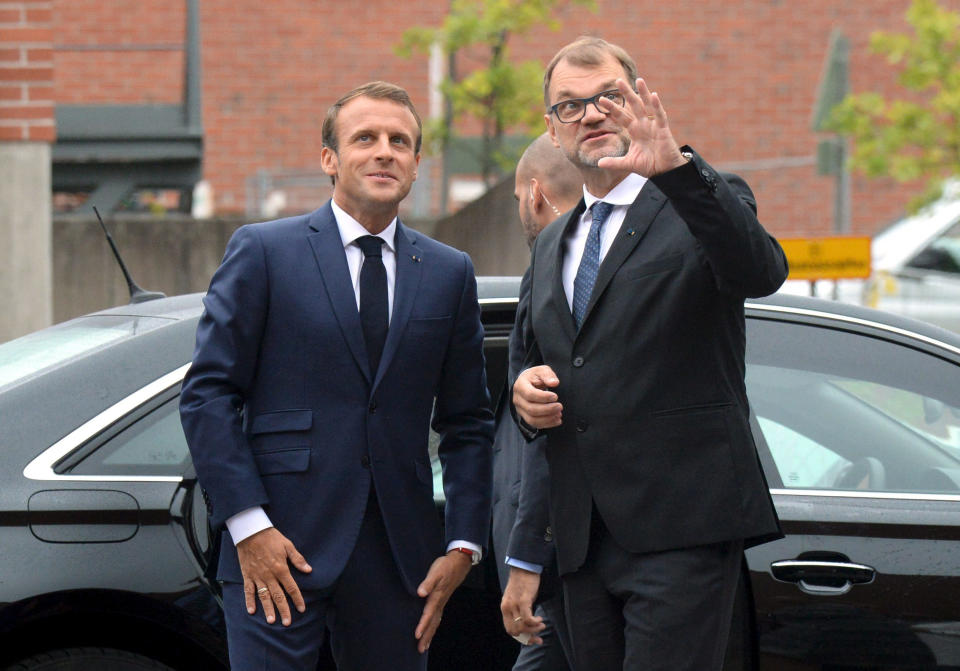 French President Emmanuel Macron, left, meets with Finland Prime Minister Juha Sipila at the Aalto University in Espoo, Finland, Thursday Aug. 30, 2018. President Macron is in Finland on a two-day official visit. (Mikko Stig/Lehtikuva via AP)