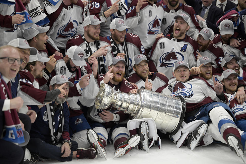 The Colorado Avalanche pose with the Stanley Cup after defeating the Tampa Bay Lightning 2-1 in Game 6 of the NHL hockey Stanley Cup Finals on Sunday, June 26, 2022, in Tampa, Fla. (AP Photo/Phelan Ebenhack)