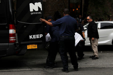 A gurney carrying the body of Kate Spade is taken from her apartment in Manhattan, New York, U.S., June 5, 2018. REUTERS/Shannon Stapleton