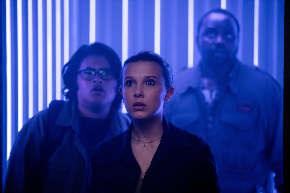 Madison Russell (Millie Bobby Brown, center, with Julian Dennison and Brian Tyree Henry) leads the charge to help her pal Godzilla in "Godzilla vs. Kong."