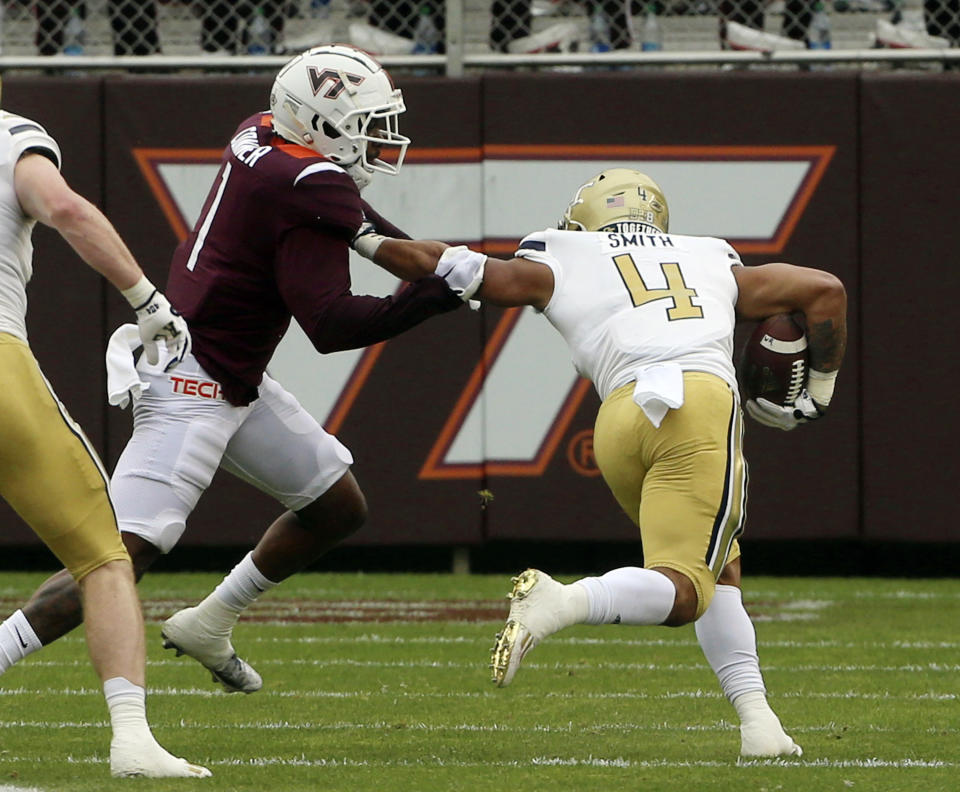 Georgia Tech's Dontae Smith (4) scores a touchdown past Virginia Tech's Chamarri Conner (1) in the first half during an NCAA college football game, Saturday, Nov. 5 2022, in Blacksburg, Va. (Matt Gentry/The Roanoke Times via AP)