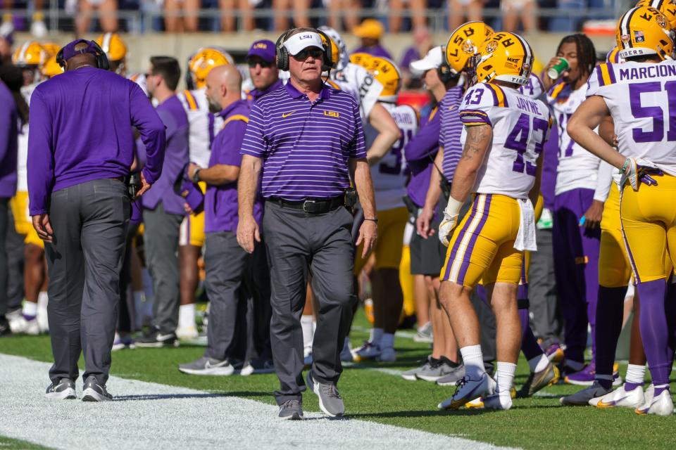 LSU coach Brian Kelly walks the sideline during his team's game against Purdue in the 2023 Citrus Bowl at Camping World Stadium.