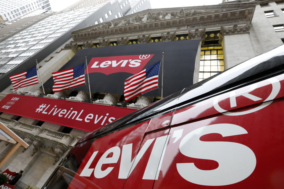 FILE - A Levi's banner adorns the facade of the New York Stock Exchange, March 21, 2019. Levi Strauss & Co said Thursday, Dec. 7, 2023, that its CEO will step down in January 2024 and hand over the reins of the jeans maker to his appointed successor. Chip Bergh will cede the CEO job to Michelle Gass, who left her CEO role at Kohl’s to become president of Levi’s in January of this year. (AP Photo/Richard Drew, File)