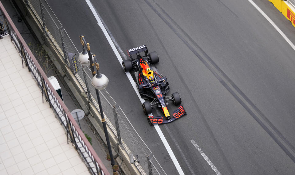 Red Bull driver Sergio Perez of Mexico steers his car during the Formula One Grand Prix at the Baku Formula One city circuit in Baku, Azerbaijan, Sunday, June 6, 2021. (AP Photo/Darko Vojinovic)