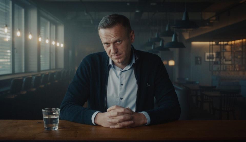 Alexei Navalny sitting at a table
