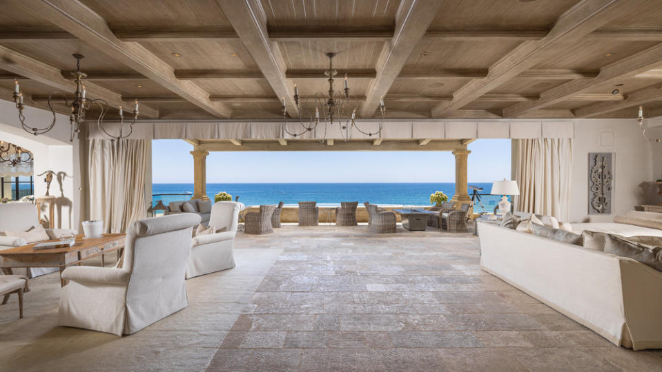 The beachfront home delivers breathtaking views from every vantage point.
