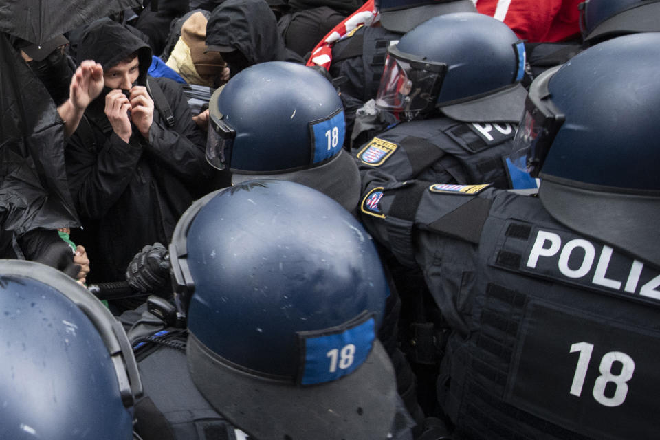 Police and demonstrators clash during the "Revolutionary May Day Demonstration" in Frankfurt Saturday, May 1, 2021. (Boris Roessler/dpa via AP)